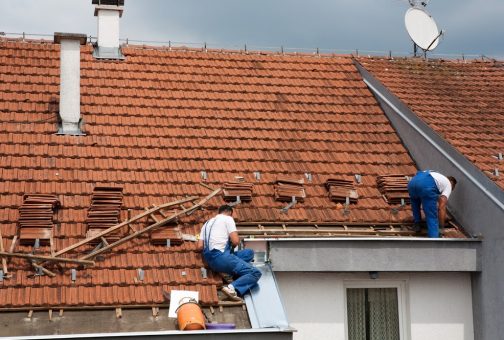 Two men working on the roof